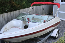 2002 caravelle 186 Boat - Bimini Top Folded  on Brace Kit - A3687UB-20 Logo Red